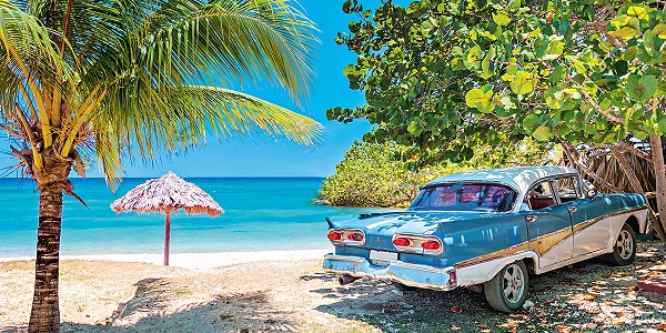 Vintage american oldtimer car parked on a beach in Cuba